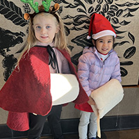 children in Christmas clothes