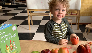 highlights_tours little boy at table with apples